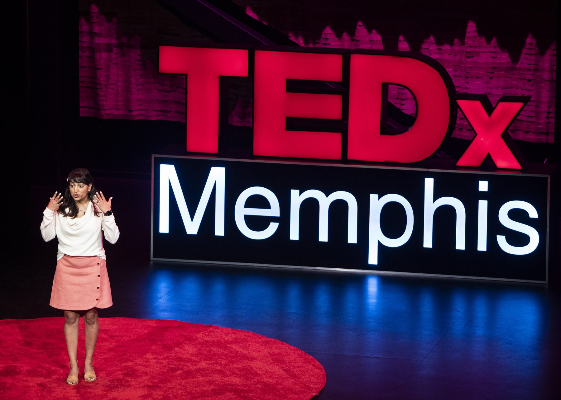 Jani Rad speaking on the TEDx Memphis stage